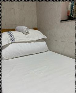 Postel nebo postele na pokoji v ubytování 安捷賓館 Famous Guest House