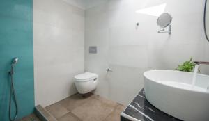 A bathroom at Gold Olive Suites by "elite"