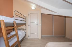 A bed or beds in a room at Gold Olive Suites by "elite"