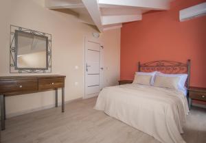 A bed or beds in a room at Gold Olive Suites by "elite"