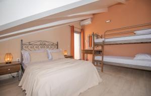 A bed or beds in a room at Gold Olive Suites by "elite"