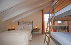 A bed or beds in a room at Gold Olive Suites by "elite"