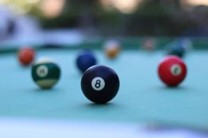 a group of billiard balls on a pool table at Apartamentos Sol Radiante in Canyamel