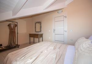 A bed or beds in a room at Gold Olive Suites by "elite"