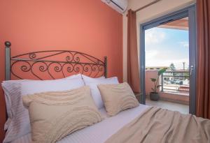 A bed or beds in a room at Gold Olive Suites by "elite"