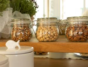 a group of jars of nuts on a shelf at Hotel Villa Maris in Rimini