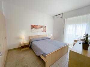 A bed or beds in a room at IL GABBIANO