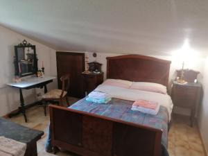 Postel nebo postele na pokoji v ubytování Luciano e Concetta