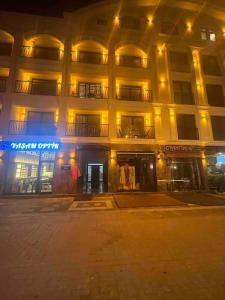 a large building with lights in front of it at Cordonn residence apart1 in Fethiye