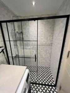 a shower with a glass door in a bathroom at Cordonn residence apart1 in Fethiye
