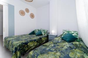 Postel nebo postele na pokoji v ubytování Espanatour BENIAJAN + 13 fotografií