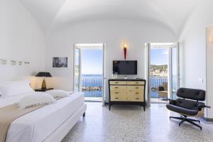 TV a/nebo společenská místnost v ubytování Roccobarocco Boutique Hotel