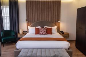 Voodi või voodid majutusasutuse Le M Hôtel toas