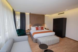 Voodi või voodid majutusasutuse Le M Hôtel toas