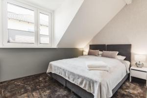 Postel nebo postele na pokoji v ubytování Livin Łeba