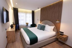 Voodi või voodid majutusasutuse Le M Hôtel toas