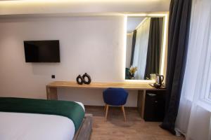 Voodi või voodid majutusasutuse Le M Hôtel toas