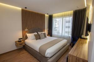 Voodi või voodid majutusasutuse Le M Hôtel toas