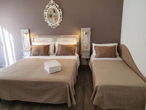 Postel nebo postele na pokoji v ubytování Hotel Villa Esedra