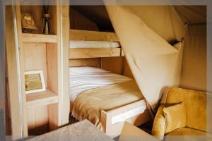 a bedroom with a bunk bed in a room at Ty Llewelyn Glamping & Camping in Llanidloes
