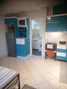 Kuchyň nebo kuchyňský kout v ubytování Penthouse in Volos