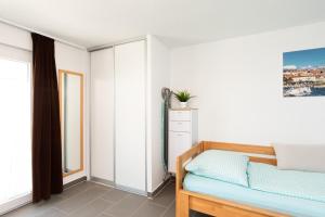 Posteľ alebo postele v izbe v ubytovaní Apartments Oleander