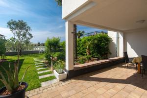Vonkajšia záhrada v ubytovaní Apartments Oleander