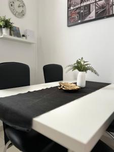 a table with a black napkin on top of it at Apartments Loncar-near Zrće beach in Novalja