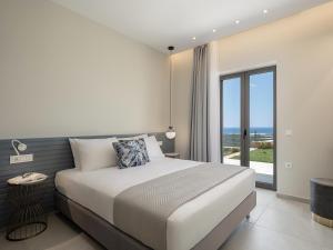 Postel nebo postele na pokoji v ubytování GG Villas Falassarna + 39 fotografií