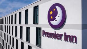 a building with the sign for premier inn at Premier Inn Freiburg City Süd in Freiburg im Breisgau