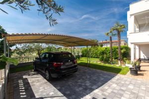 Vonkajšia záhrada v ubytovaní Apartments Oleander