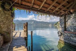 a view of a lake from a dock at Villa Vescovo Appartamento con accesso al lago in Orta San Giulio