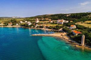 an aerial view of a small island in the water at Apartments Loncar-near Zrće beach in Novalja