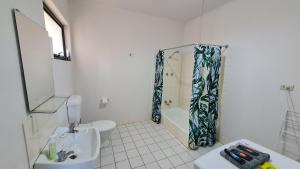 a bathroom with a sink and a shower curtain at Stay Awhile in Port Pirie - min stay 4 nights in Port Pirie