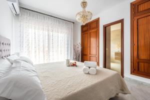 a bedroom with a bed with two towels on it at Chalet Marbella Beach I in Marbella