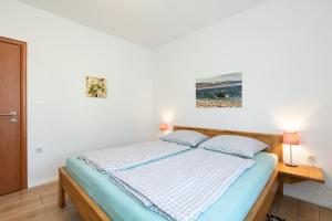 Posteľ alebo postele v izbe v ubytovaní Apartments Oleander