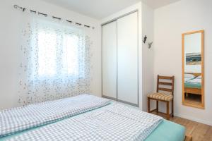Posteľ alebo postele v izbe v ubytovaní Apartments Oleander