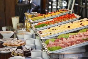 a buffet line with many different types of food at Parkhotel Morris Novy Bor in Nový Bor