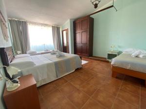 Postel nebo postele na pokoji v ubytování B&B La Pitraia