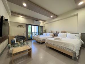 Katil atau katil-katil dalam bilik di Dongjin Bay B&B