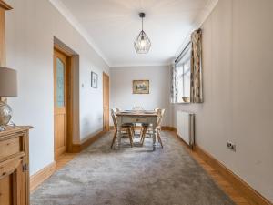 a dining room with a table and chairs at The Hideaway in Morpeth