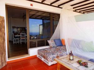 a bedroom with a bed and a view of the ocean at Apartamento deluxe Betancort in La Asomada