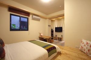 Katil atau katil-katil dalam bilik di Jiaoxi Song Tian B&B