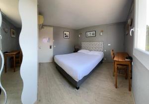 Ένα ή περισσότερα κρεβάτια σε δωμάτιο στο Contact Hotel LE SUD Montpellier Aéroport Parc Expo Arena