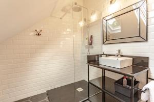 a bathroom with a sink and a mirror at Apartamentos As Barxas Playa in Moaña +47 photos