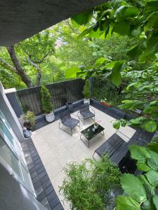 an overhead view of a patio with chairs and a table at Garden Apartament Petrila in Petrila