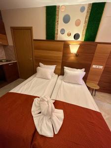 A bed or beds in a room at Briz Beach apartments - section B