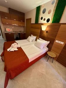 A bed or beds in a room at Briz Beach apartments - section B