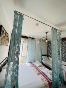 Кровать или кровати в номере Bonjourla Otel