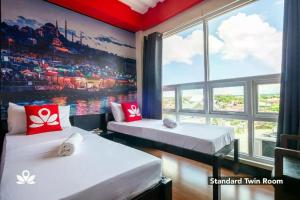 Postel nebo postele na pokoji v ubytování Sabel Travelers Inn